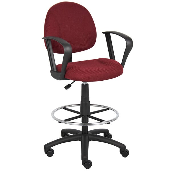 A red Boss drafting stool with black arms and base.
