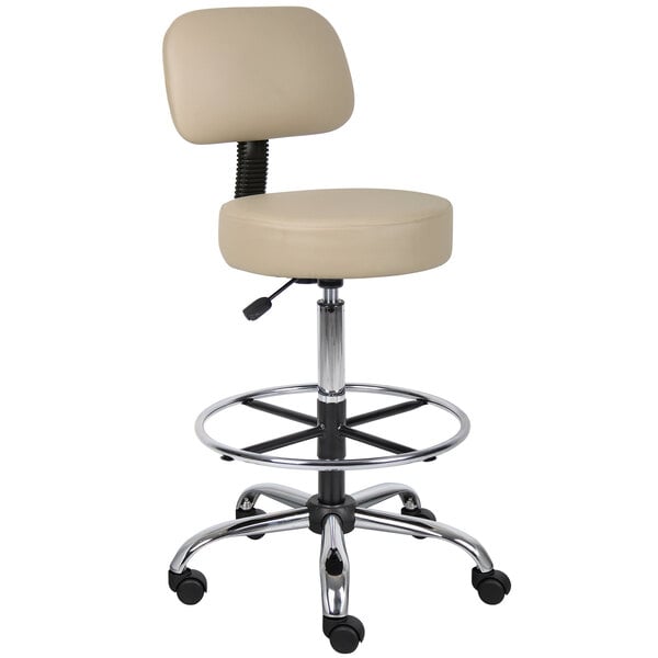 A Boss beige vinyl drafting stool with a round seat and back cushion on a chrome base.