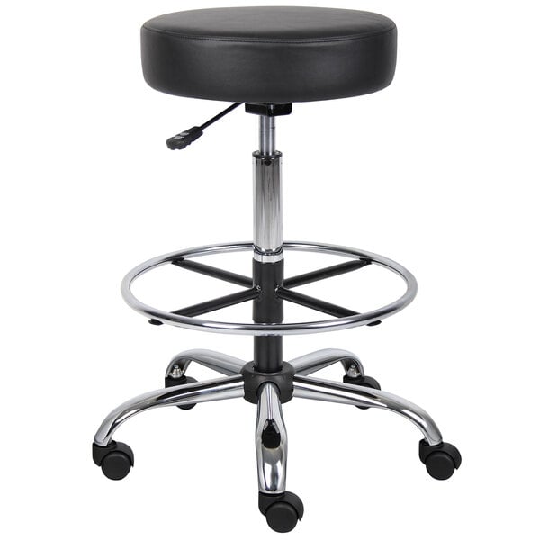 A black Boss drafting stool with chrome legs and wheels.