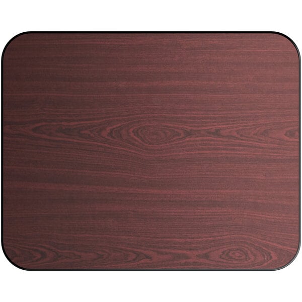 A close-up of a Lancaster Table & Seating rectangular wood table top with a reversible cherry and black finish.
