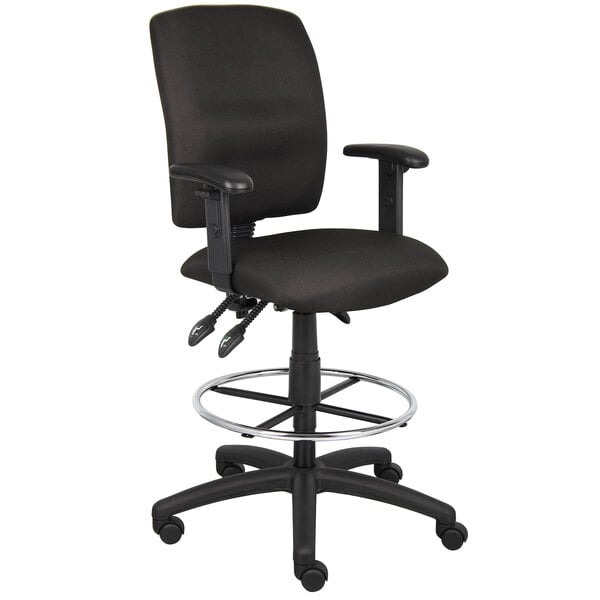 A Boss black drafting stool with a chrome base and adjustable arms.