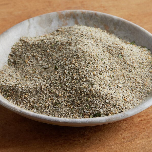 A bowl of ground spices on a table.