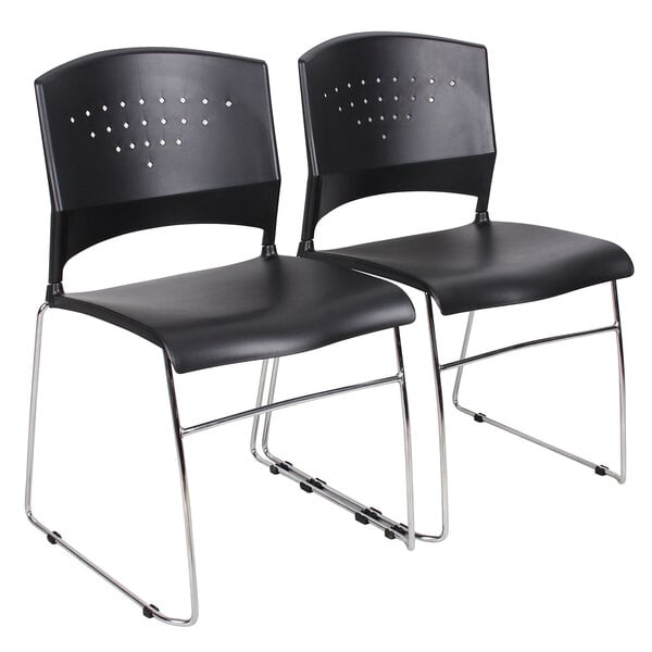 A pair of black Boss stack chairs with chrome legs.