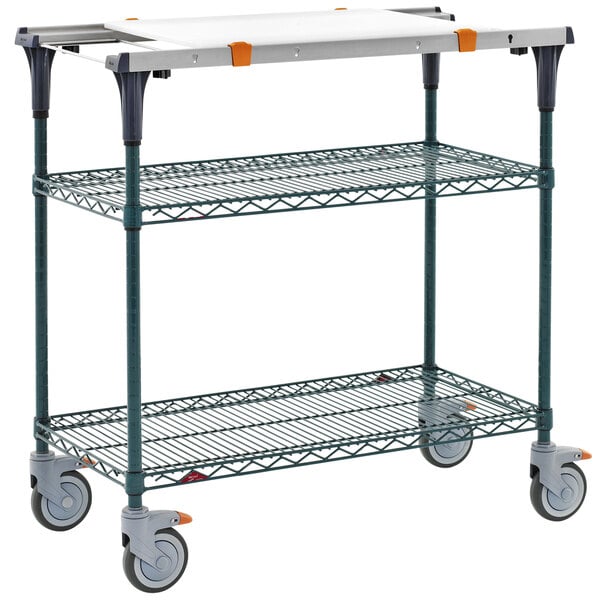 A Metro PrepMate MultiStation cart with wheels and a white surface.