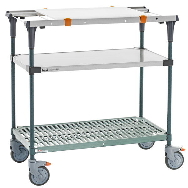 A Metro PrepMate cart with wheels and shelves.
