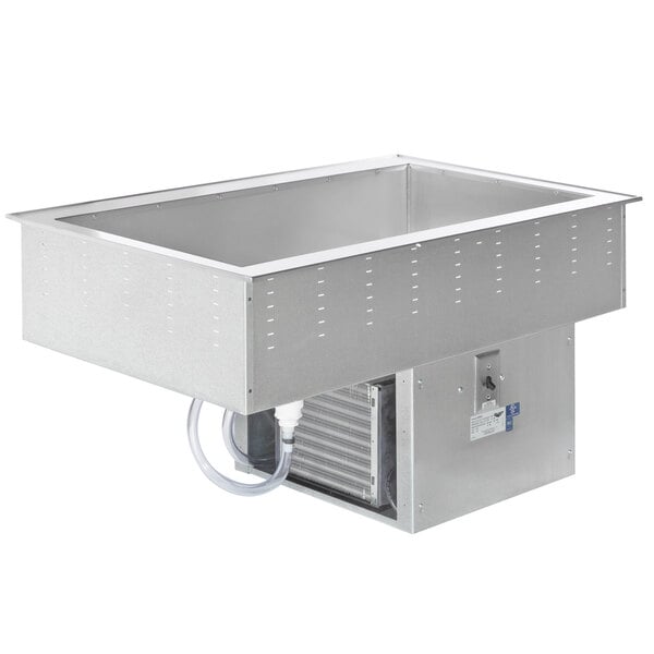 A stainless steel Vollrath drop-in refrigerated cold food well with a drain.