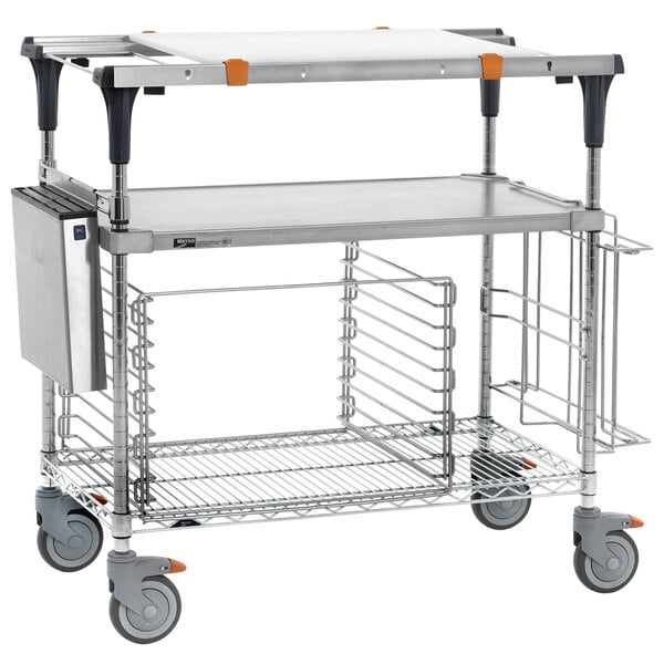 A Metro PrepMate MultiStation cart with shelves and a tray on a counter.