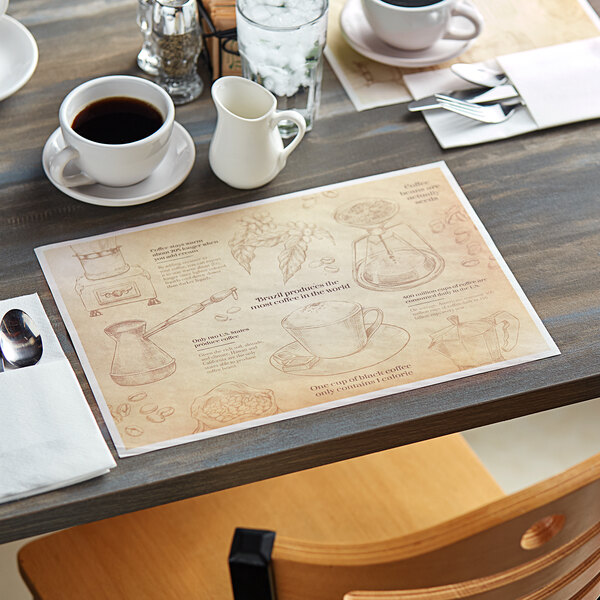 A table set with Choice coffee themed paper placemats, coffee cups, and utensils.