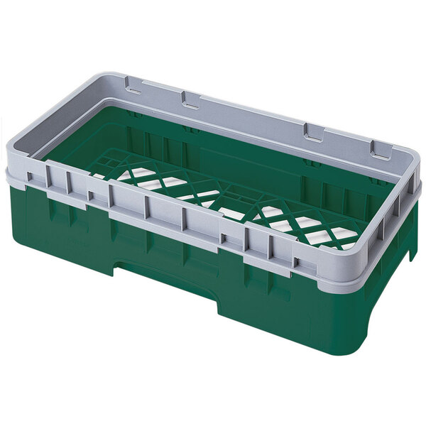 A green Cambro plastic dish rack with an open base and handle.