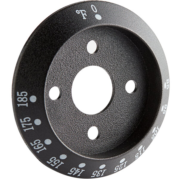 A black circular knob with white text on it.