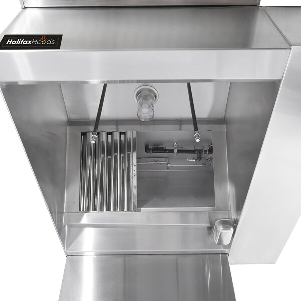 A stainless steel Halifax commercial kitchen hood system with a metal box and pipes inside.