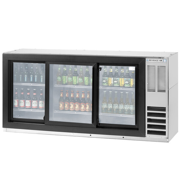 A Beverage-Air back bar refrigerator with glass doors filled with beer bottles.