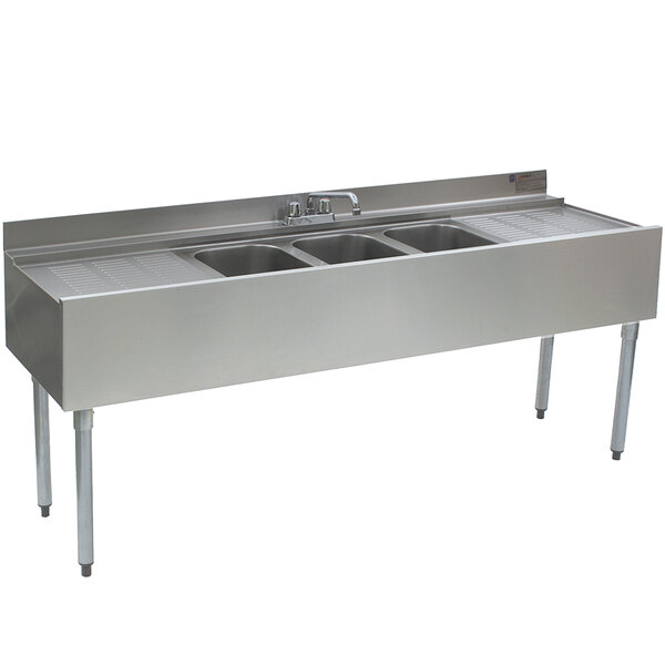 A stainless steel Eagle Group underbar sink with three compartments and two drainboards.