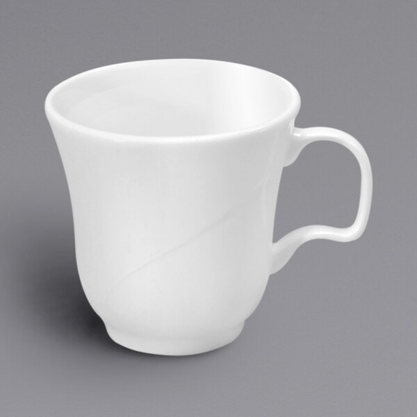 An embossed white bone china tall cup with a handle.