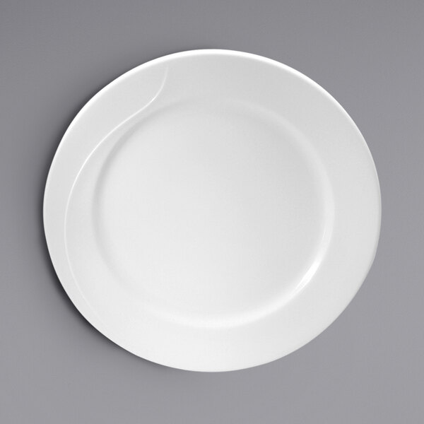 An embossed white bone china mid rim plate by Oneida on a gray surface.