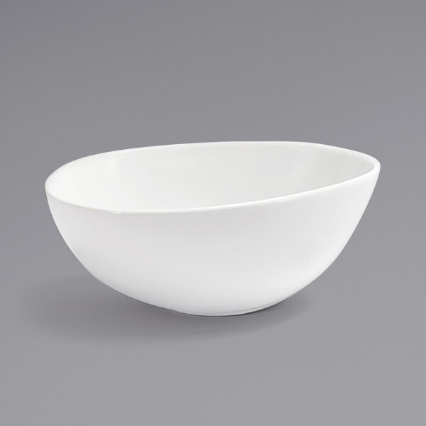 A Front of the House white porcelain bowl with a small rim on a gray background.