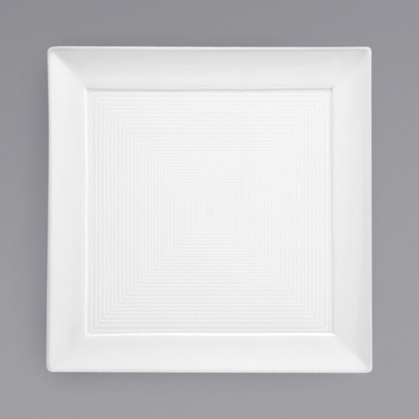 A white square porcelain plate with a square spiral pattern.