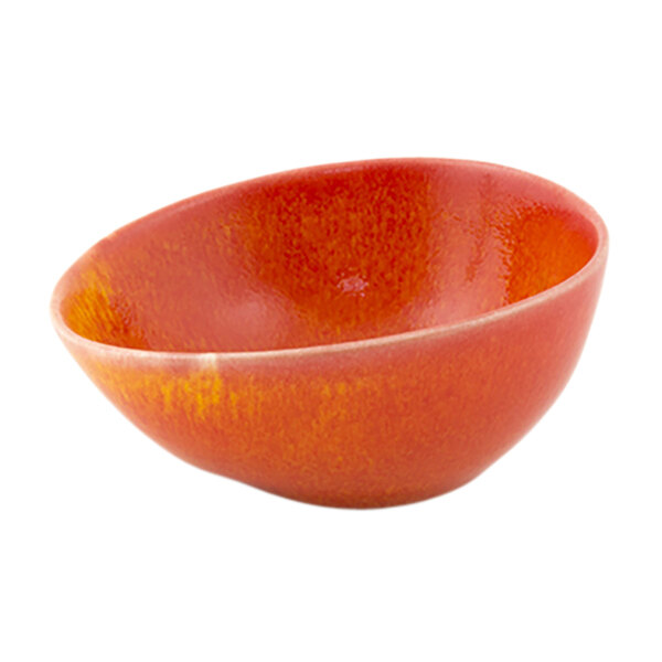 A close-up of a white bowl with a red and orange interior.