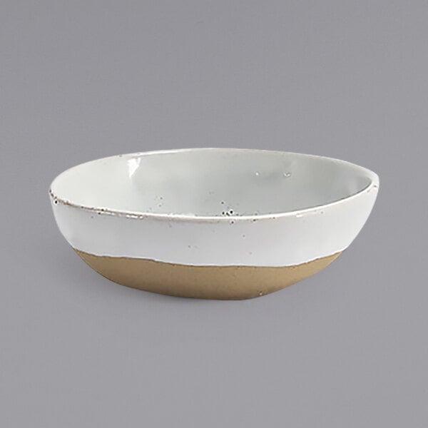 A white bowl with a tan rim.
