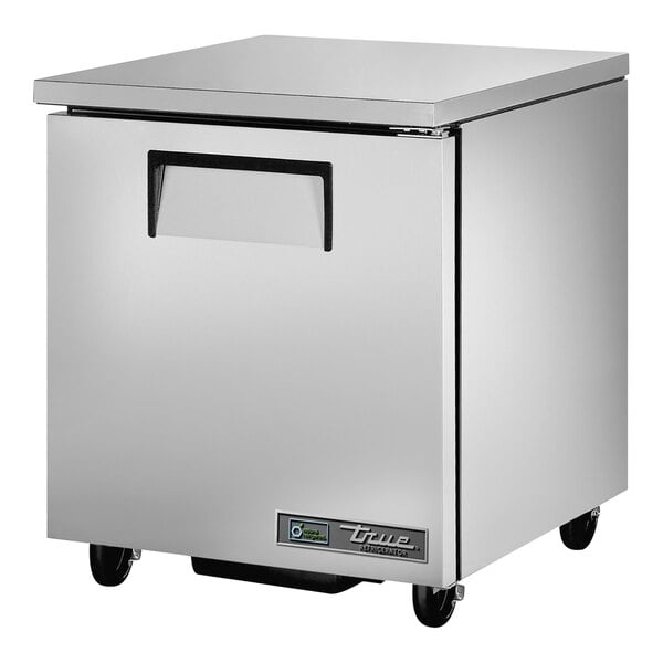 A silver True T-Series undercounter refrigerator with wheels.