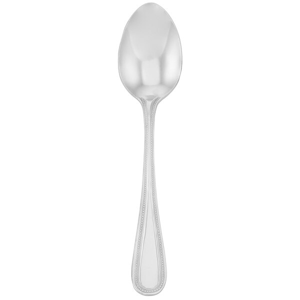 A silver Walco Accolade dessert spoon with a handle.