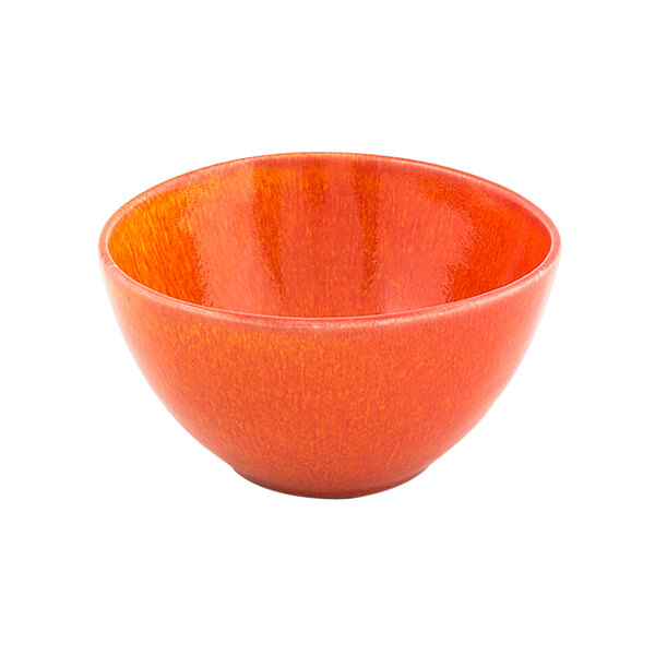 A white porcelain bowl with orange paint on the inside.