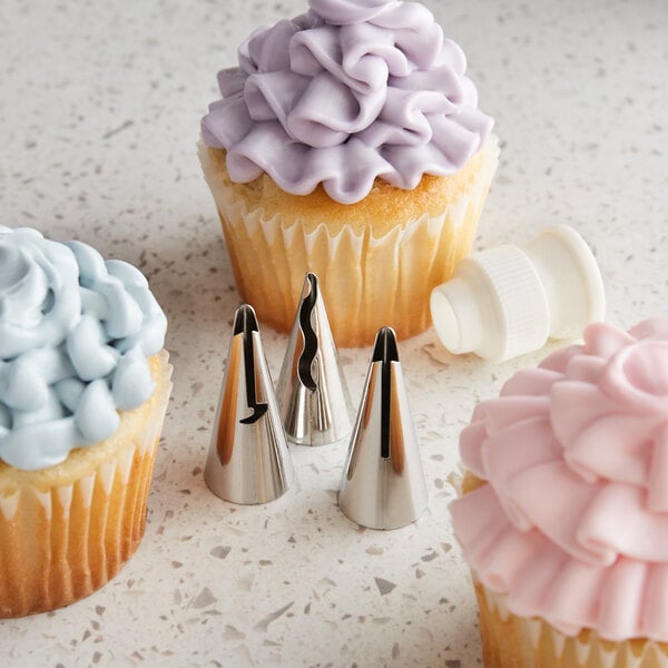 A close up of a cupcake with purple ruffle frosting made using Ateco ruffle piping tips.