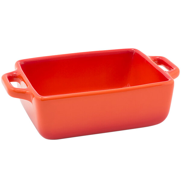 A red rectangular ceramic Front of the House ovenware dish with handles.