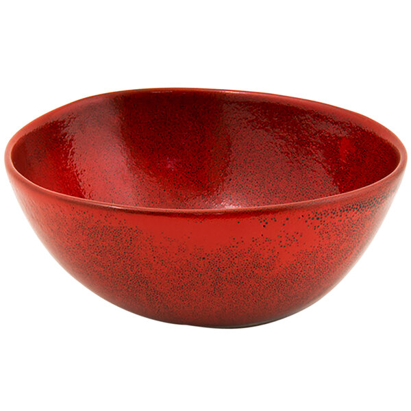 A red porcelain bowl with a shiny surface.
