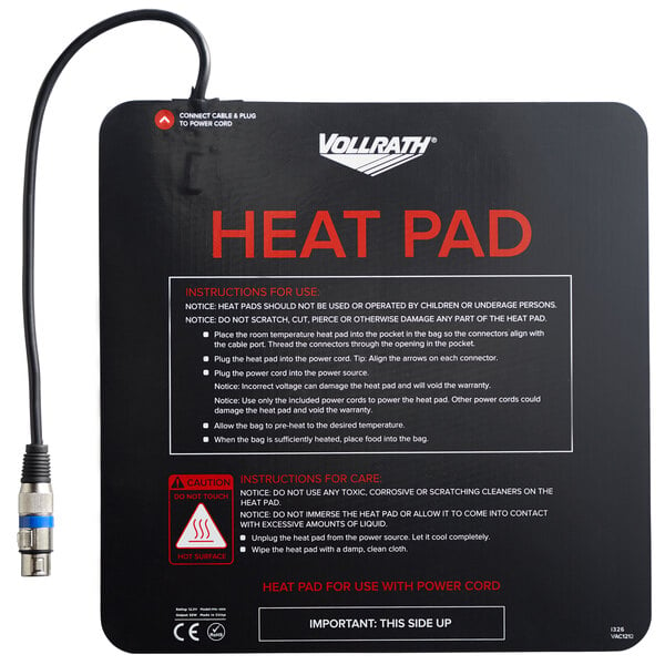 A black square Vollrath heating pad with a wire attached to it.