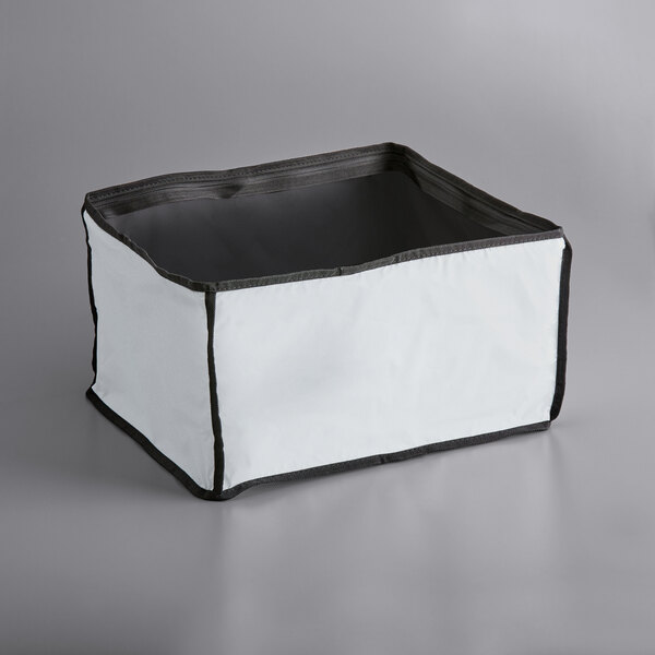 A white and black fabric liner for a medium Vollrath catering bag.