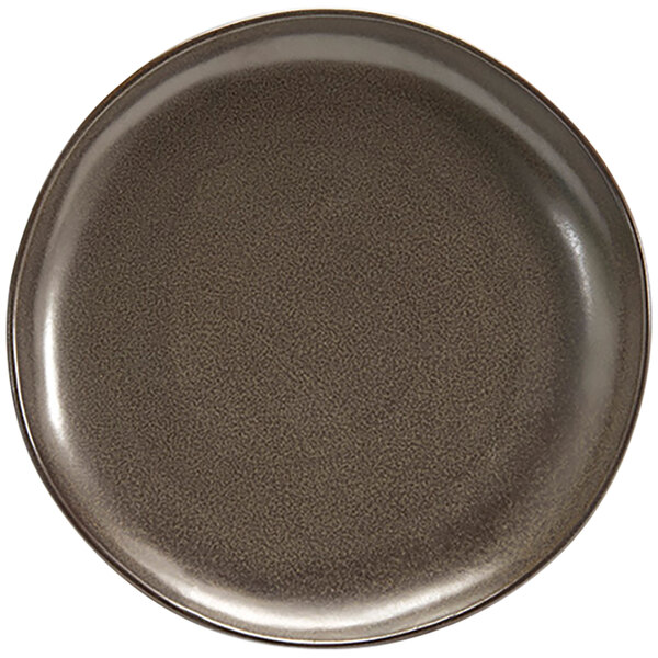 A brown porcelain plate with a black rim.