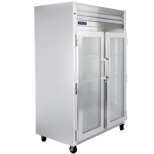 A Traulsen G Series glass door refrigerator with left and right hinged doors.