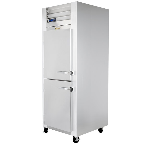 A white Traulsen G Series reach-in freezer with two left hinged doors and two handles.