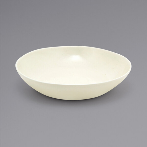 A Front of the House vanilla bean porcelain bowl on a gray background.