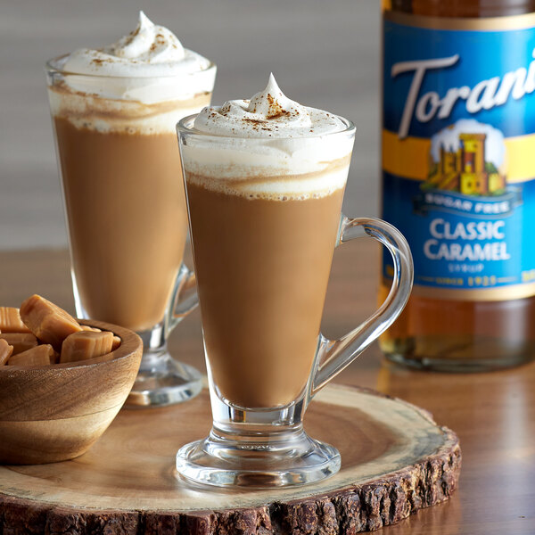 A glass cup of coffee with Torani Sugar-Free Classic Caramel Flavoring Syrup.