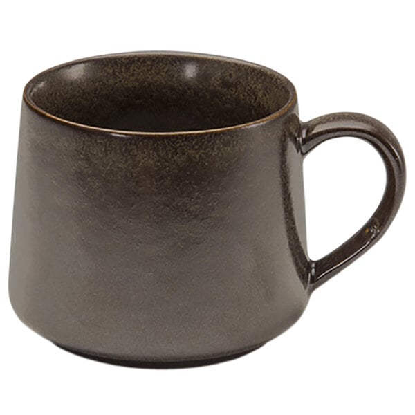 A brown porcelain cup with a handle.