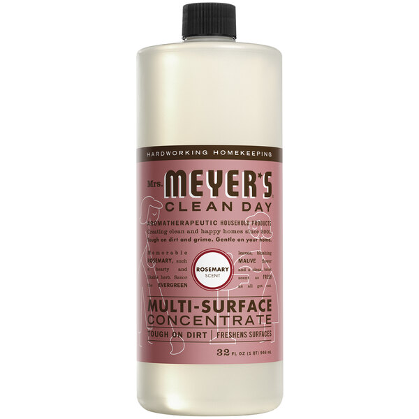 A bottle of Mrs. Meyer's Rosemary Multi-Surface Concentrate on a counter.