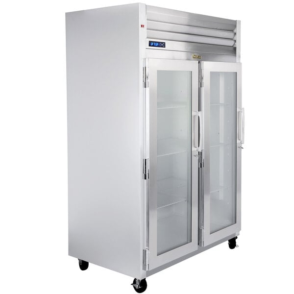 A Traulsen G Series glass door reach-in refrigerator with left hinged doors.