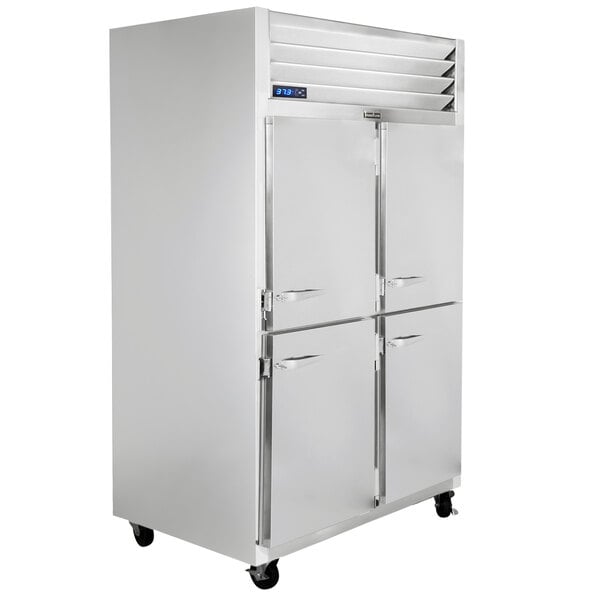 A white Traulsen G Series reach-in refrigerator with silver handles.