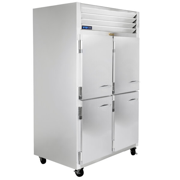 A white Traulsen G Series reach-in freezer with silver handles.