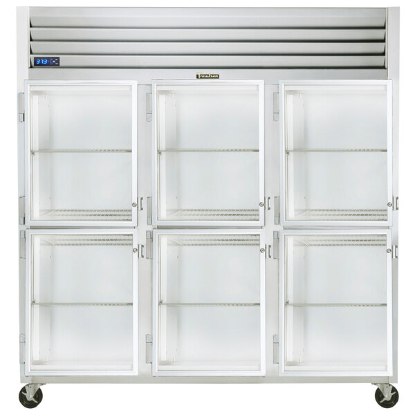 A Traulsen white G Series reach-in refrigerator with glass half doors and shelves.