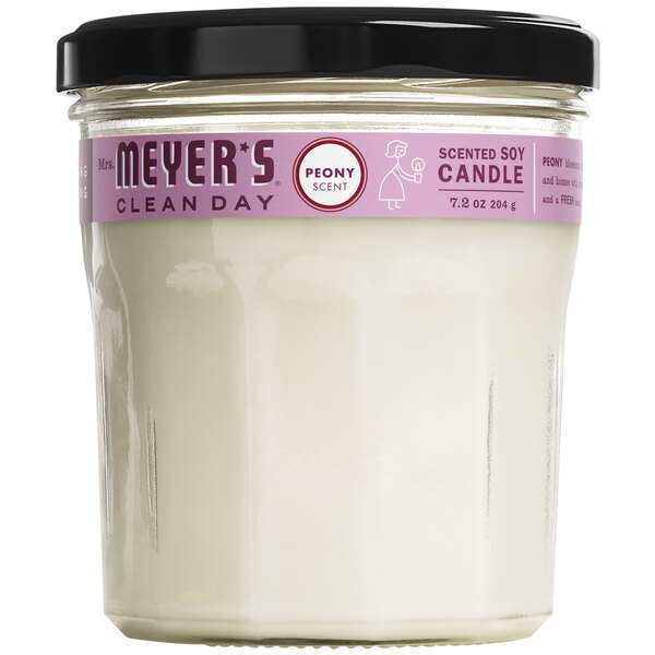 A white Mrs. Meyer's Clean Day peony scented wax candle in a jar with a black lid.
