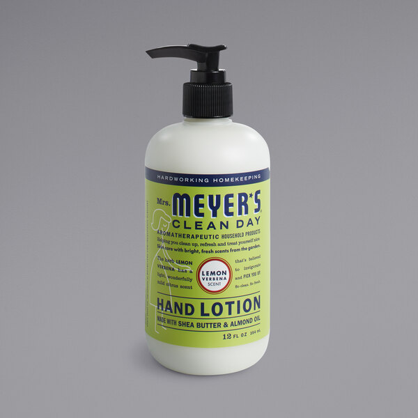 A case of 6 white Mrs. Meyer's Clean Day Lemon Verbena hand lotion bottles with black dispensers.