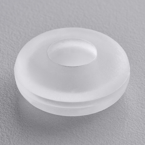 A white round silicone grommet with a hole in the center.
