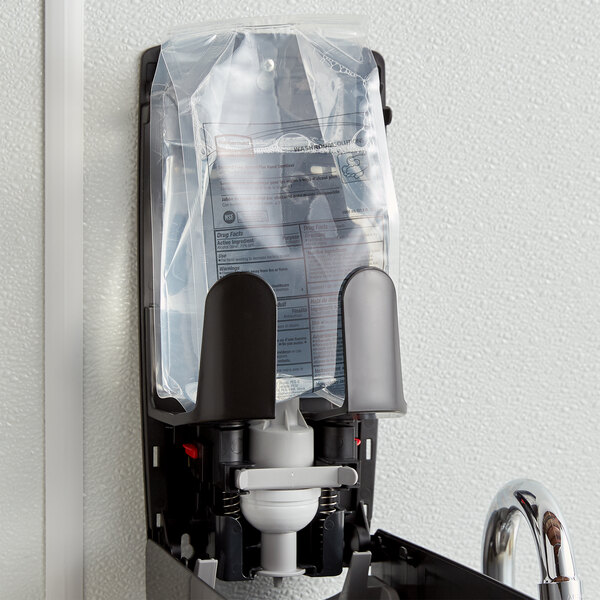 A black Rubbermaid plastic bag of Flex enriched foam hand sanitizer on a dispenser.