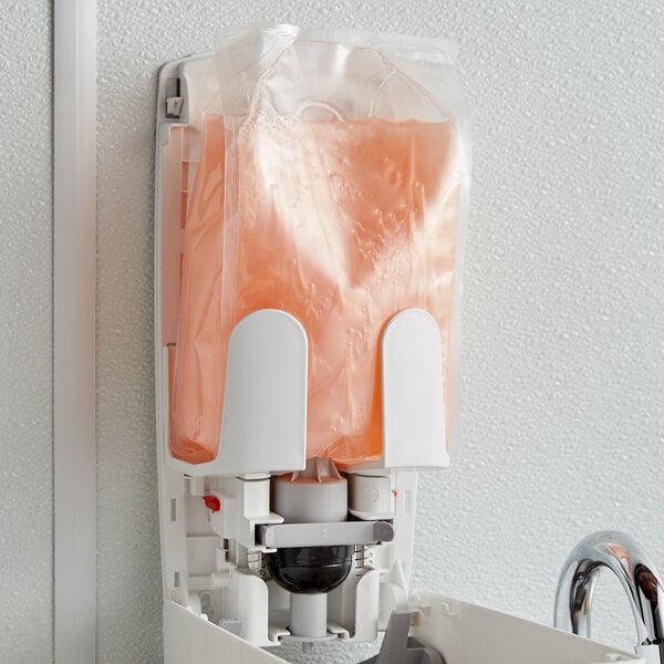A wall-mounted Rubbermaid Flex Enriched Lotion hand soap refill bag.