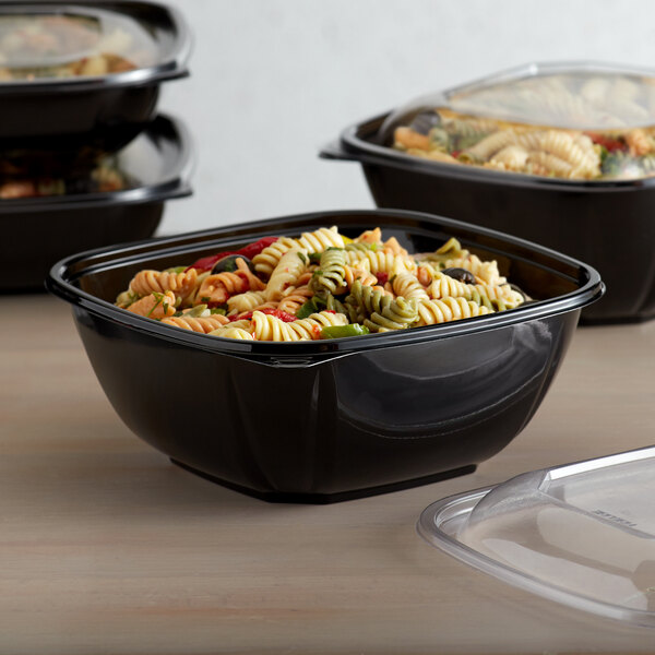 A Fineline black square PET plastic bowl filled with pasta and salad.