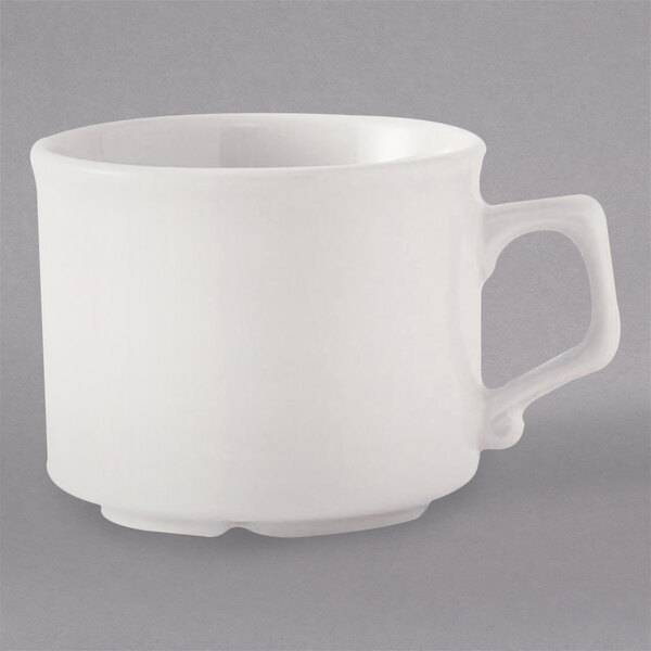 A Tuxton eggshell white tea cup with a large handle.