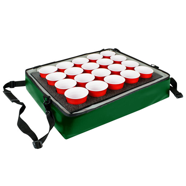 A green Sterno insulated drink holder with red cups on it.